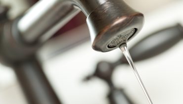 Close-up of Water Dripping from Water Faucet