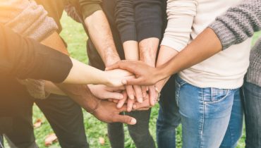 Multiracial Group of Friends with Hands in Stack